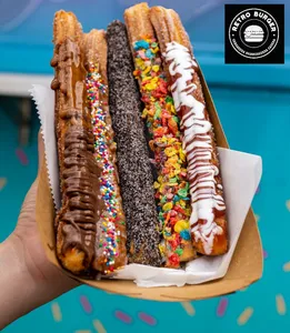 4 Churros Bañados en Chocolate