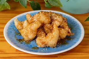 Porción 80 gr pollo a la naranja