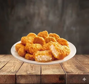 10 Crujientes Nuggets de pollo, acompañado de salsa BBQ.