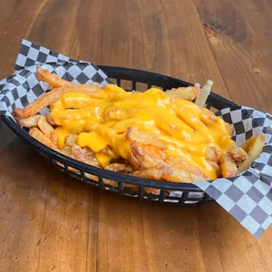 Salsa cheddar en papas