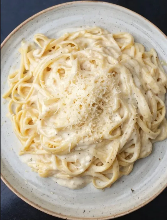 Porción de tallarines a la crema