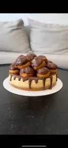 Porción Cheesecake Profiteroles