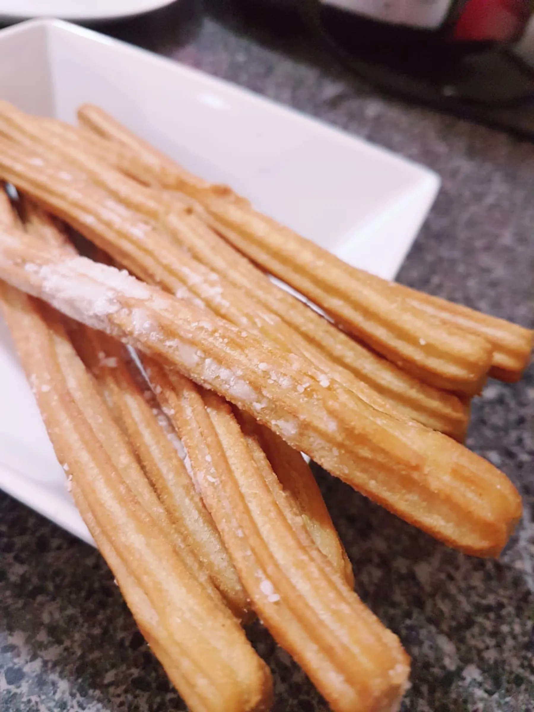 Churros españoles con azúcar flor y manjar La Provincia