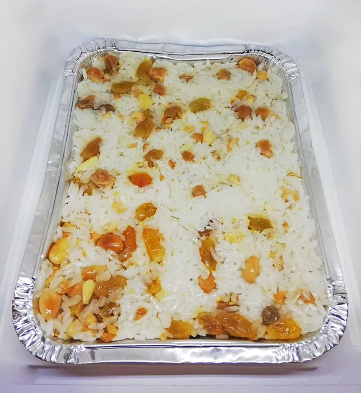 Arroz con pasas  y almendras x 4 porciones