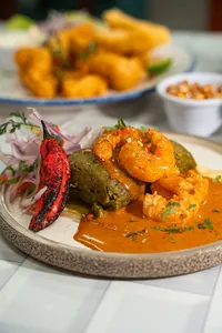 Tamal en Salsa de Langostinos