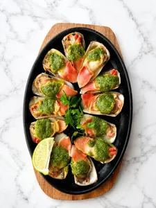 12 unidades de machas con salsa persilade