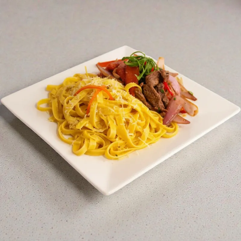 Fetucci a la Huancaina con lomo saltado Fetucci a la Huancaina con lomo saltado