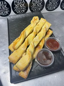 Porción de palitos de ajo (7 unidades)