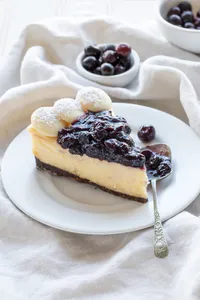 Cheesecake chocolate bco y arándanos (trozo)