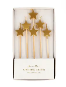 velas estrellas doradas