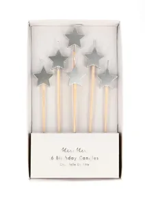 velas estrellas plateadas