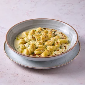 Gnocchi De Papa Amarilla En Salsa Cuatro Quesos Gratinados