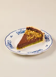 Torta pistacho y chocolate porcion