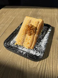 Trozo de Panqueque Naranja Manjar
