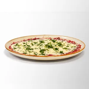 Carpaccio de lomo con salsa de la casa