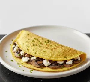 Omelete champiñones y queso  de cabra