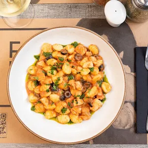 Gnocchi con ragu di pesce