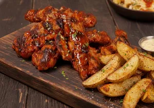 500grs Costillitas asadas al grill bañadas con tu aderezo favorito