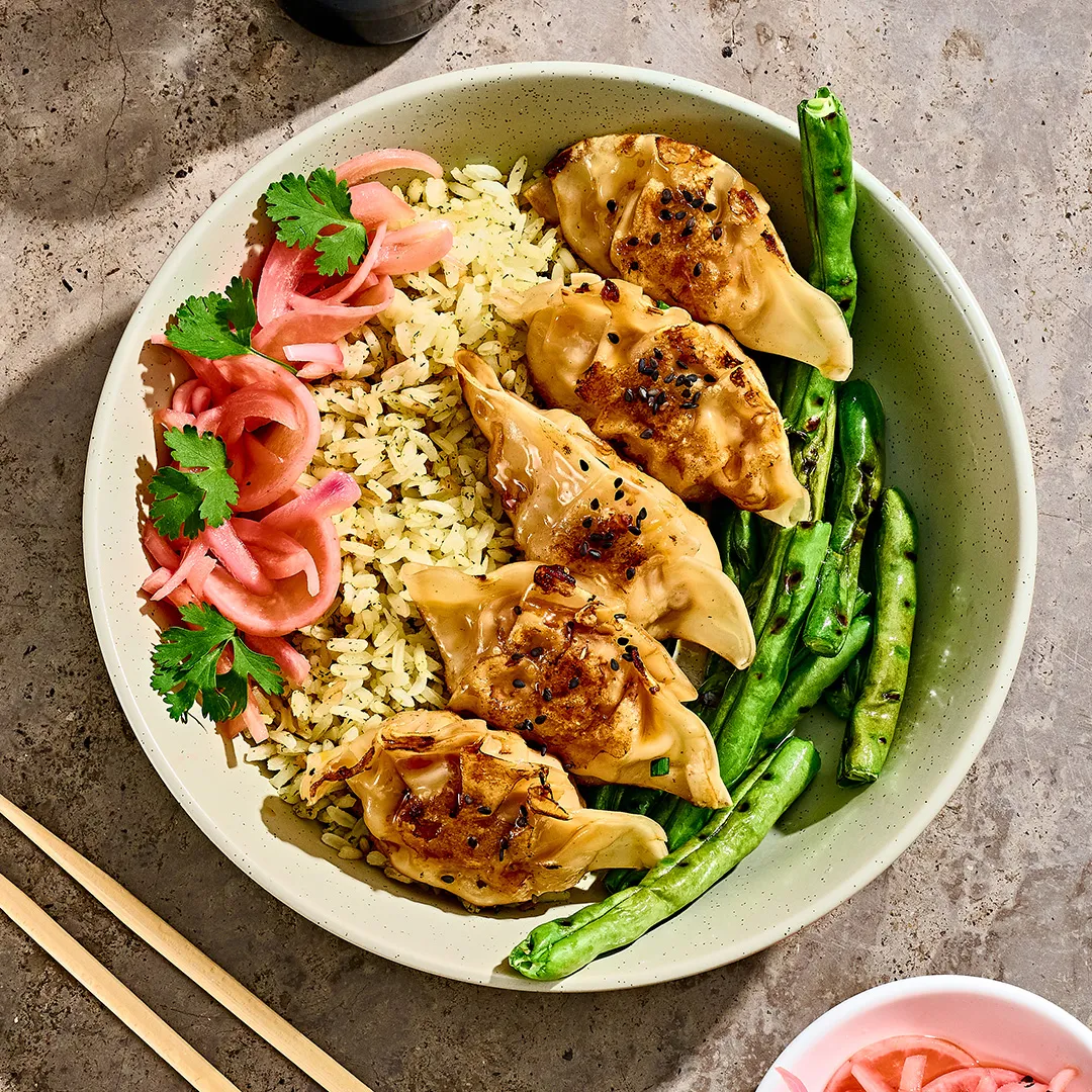 Pork Gyozas & Lime Rice 1/2 Porción - Naked Kitchen | Ordena online