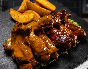 10 piezas de Alitas adobadas (corte americano)