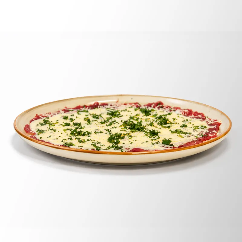 Carpaccio de lomo con salsa de la casa